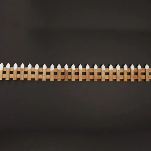 Short Snow Capped Natural Wooden Picket Fence Store